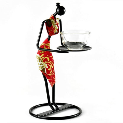 Handcrafted Asian tea set centerpiece with cloth and iron figure holding glass teacup