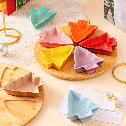 Close view of gradient porcelain tree dishes with smooth finish arranged on matching ceramic stand