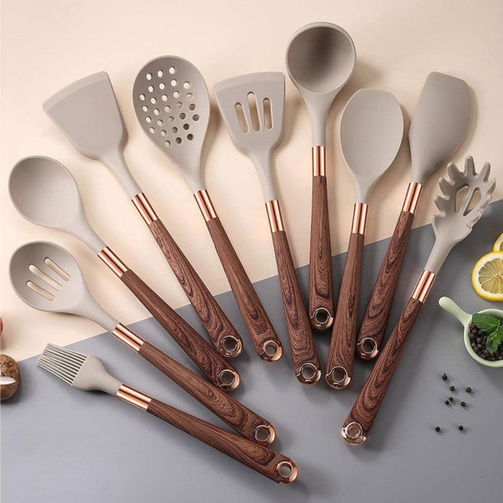 Heat resistant silicone spatula and cooking tools with ergonomic wood grain handles for everyday cooking.