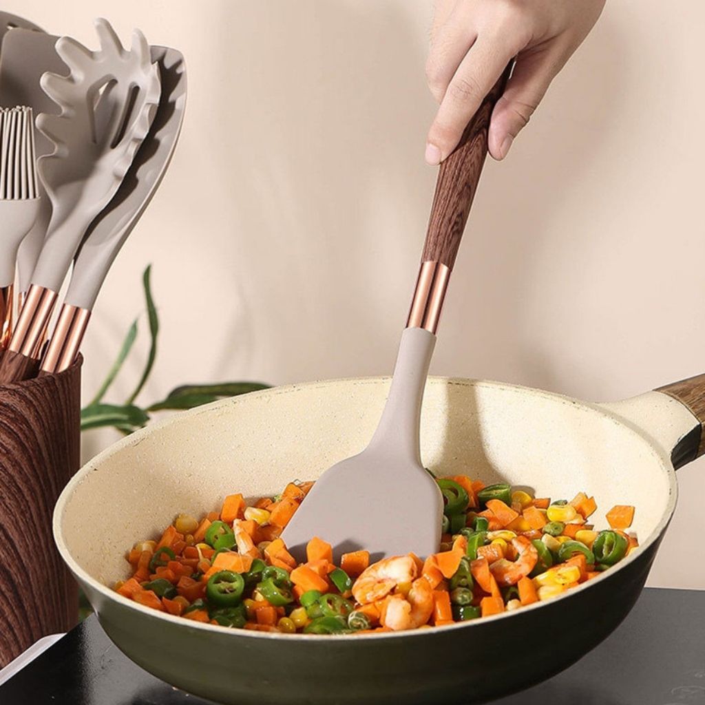 Space-saving silicone kitchen tools with hanging holes and compact storage container for efficient organization.