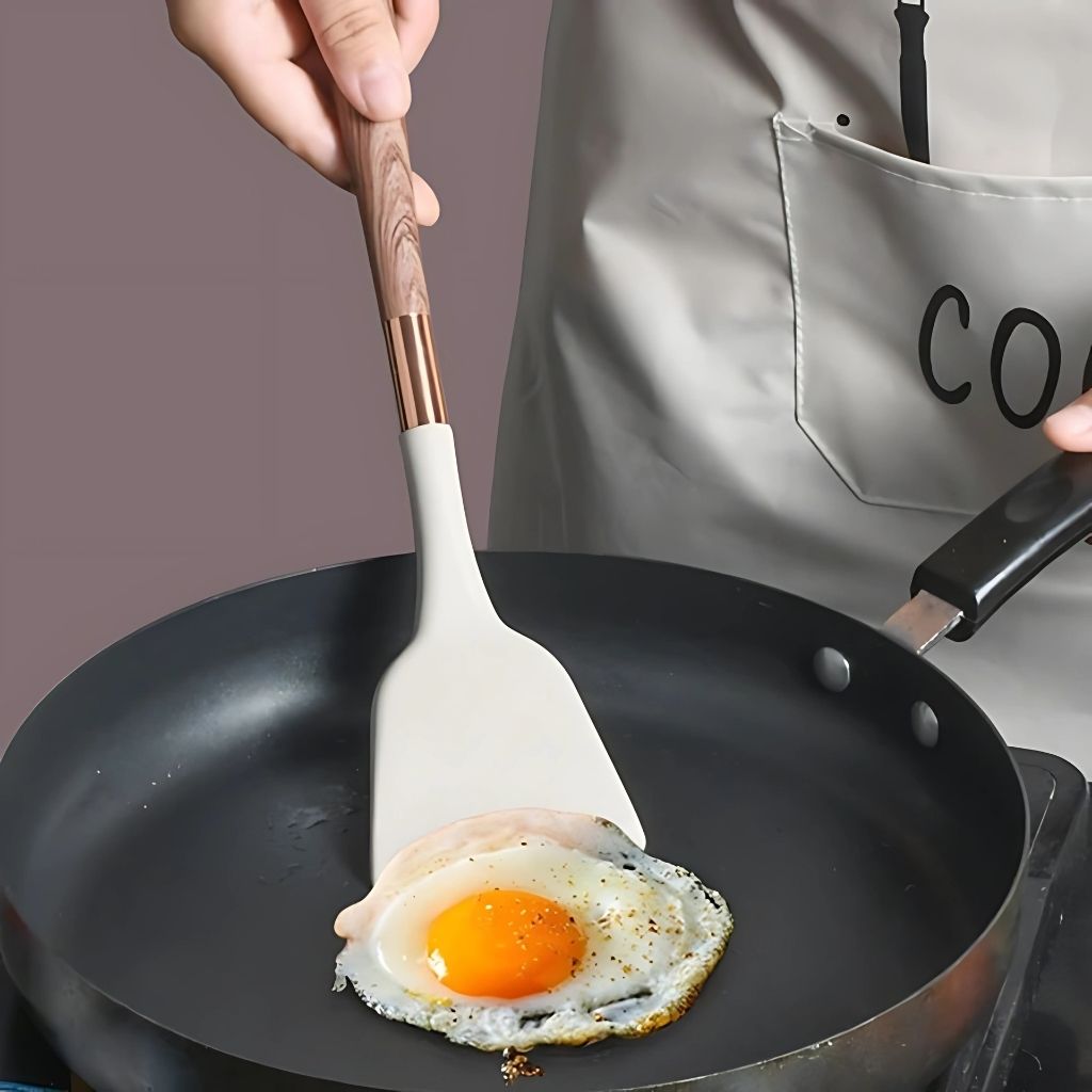 Durable silicone cooking spoons and utensils, BPA-free and dishwasher safe for healthy meal preparation.