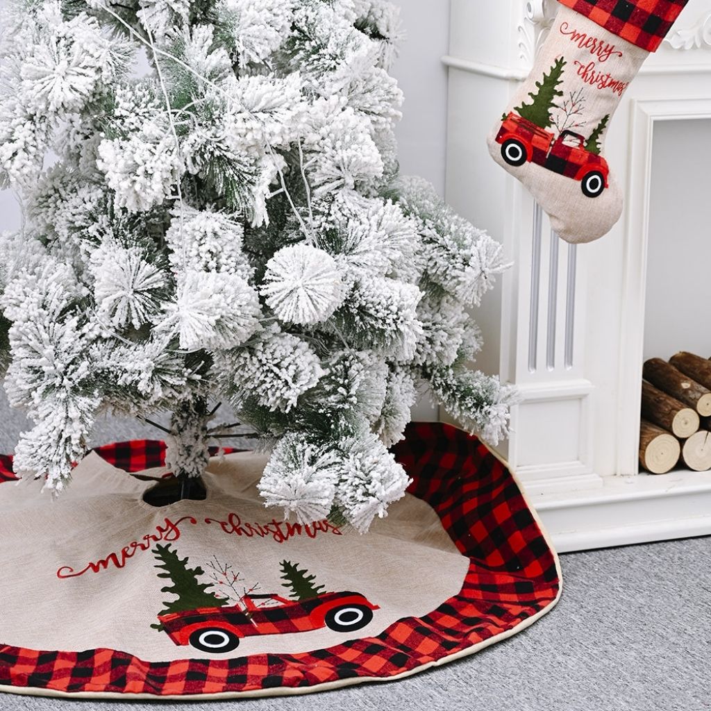 Rustic red and black plaid tree skirt featuring vintage truck with Christmas trees illustration