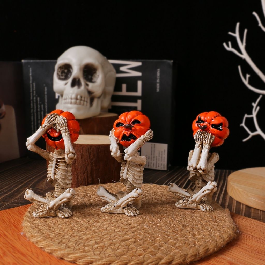 Pumpkin skull trio figurines featuring skeleton bodies with carved jack-o-lantern heads for halloween decorations