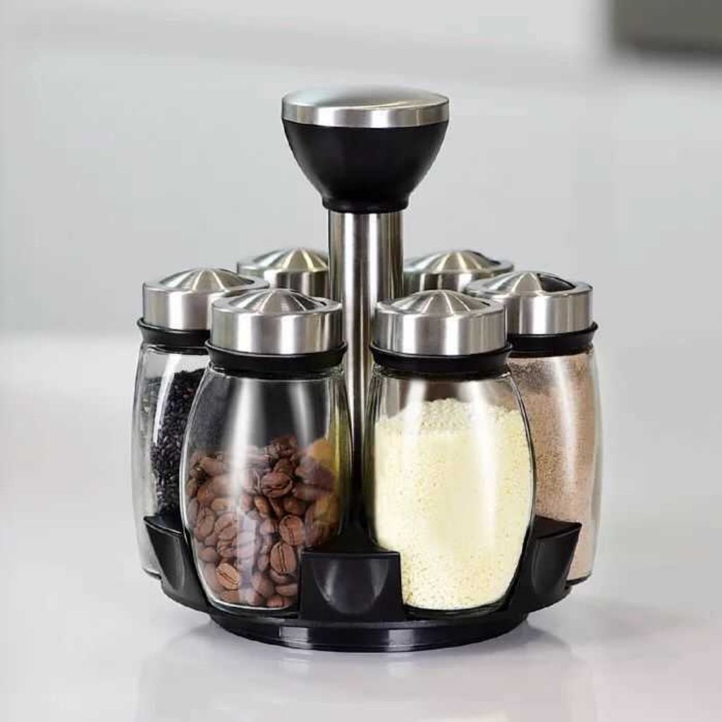 Glass spice jar set with rotating base featuring 6 containers and stainless steel caps for kitchen organization

