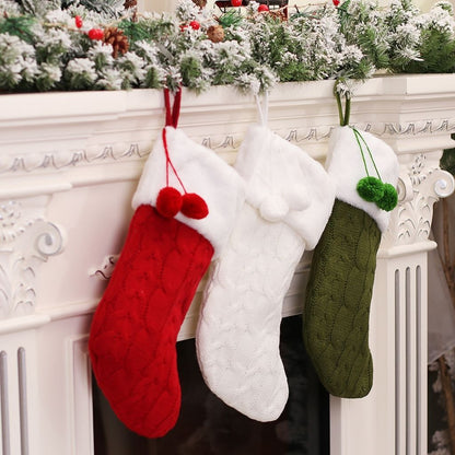 Knitted christmas stocking with festive pattern hanging display