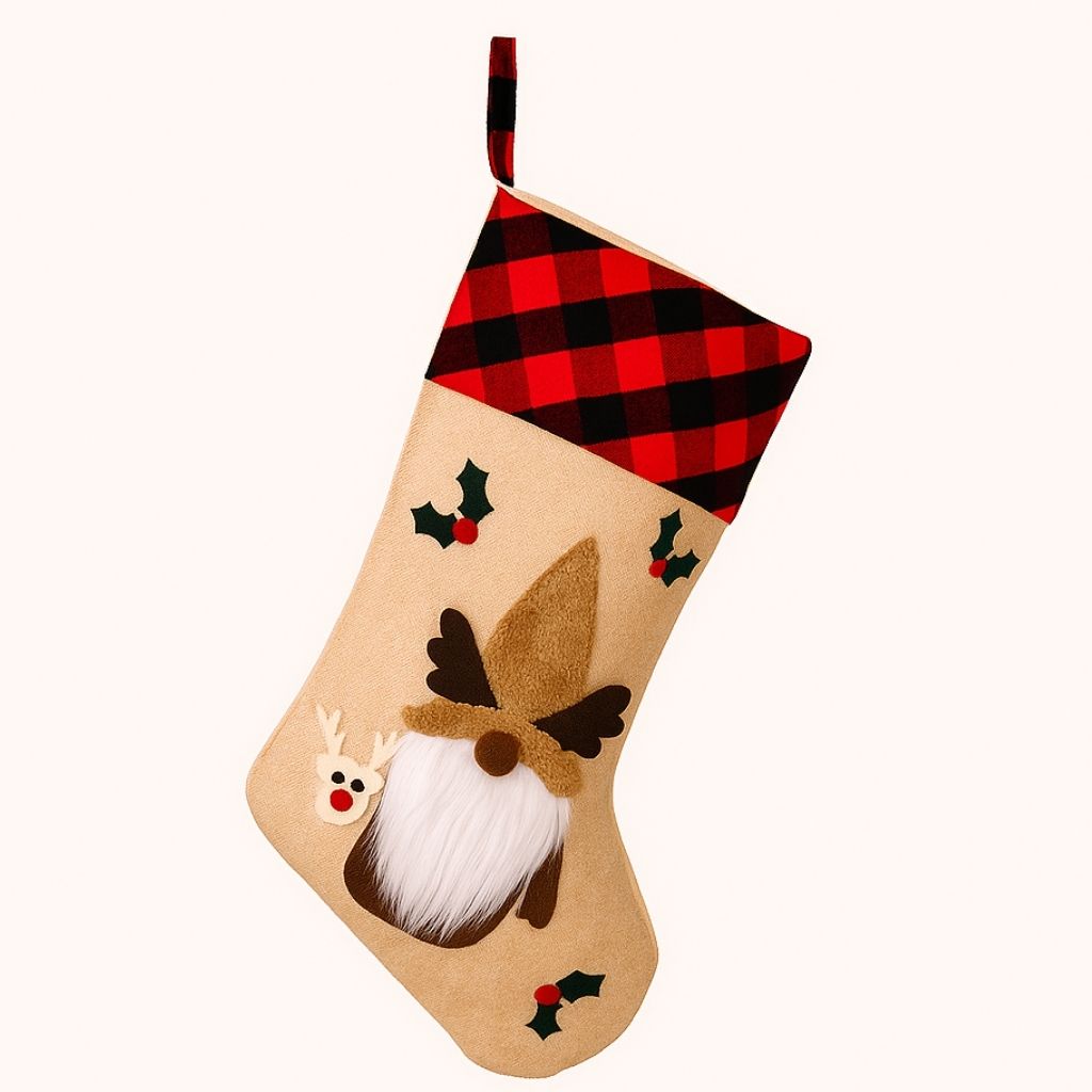 Christmas stocking with reindeer design and plaid top on a white background