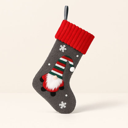 Embroidered gnome Christmas stocking with red plush cuff and soft cloth body