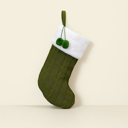 Close up of knitted holiday stocking showing textured pattern detail