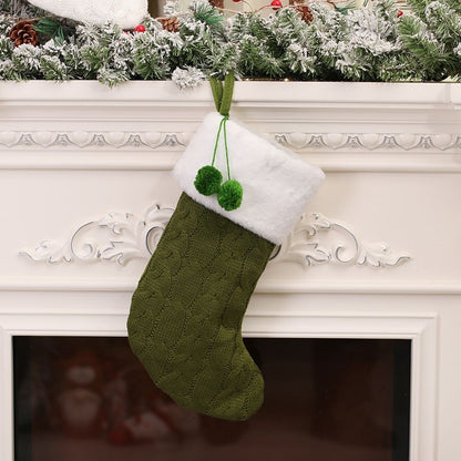 Knitted christmas stocking with decorative pattern and cuff detail
