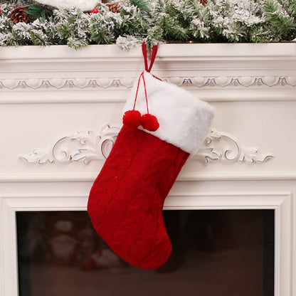 Holiday stocking in knitted fabric with traditional festive design