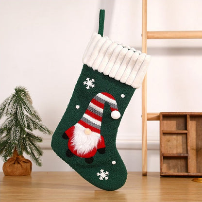 Christmas stocking with gnome design showing detailed embroidery and plush trim