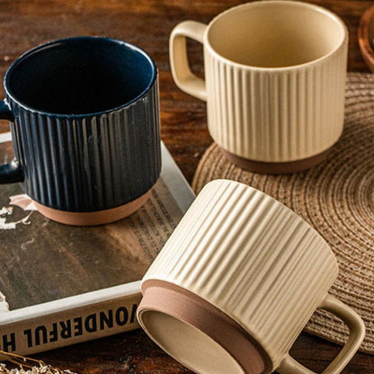 Handcrafted ceramic mug featuring artisan striped pottery design, stylish coffee accessories for kitchen decor