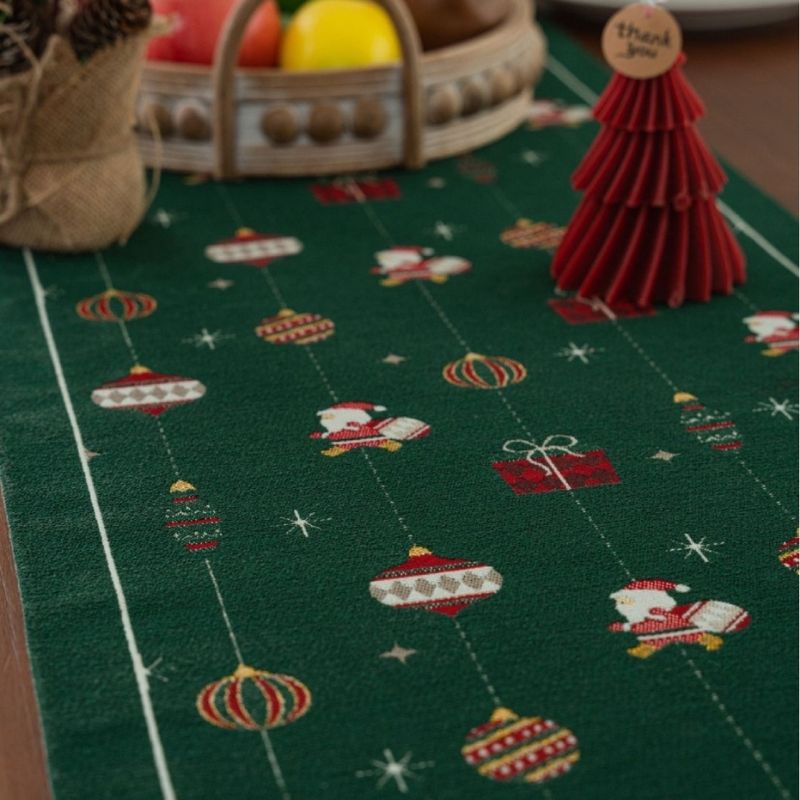 Polyester jacquard table runner featuring holiday gift box motif