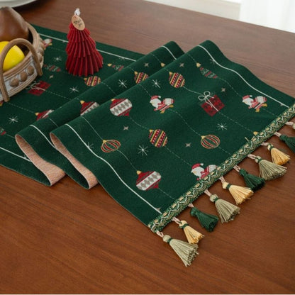 Festive green table runner with textured jacquard gift box weave
