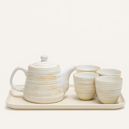 Nordic ceramic teapot with matching cups featuring textured matte glaze and retro design