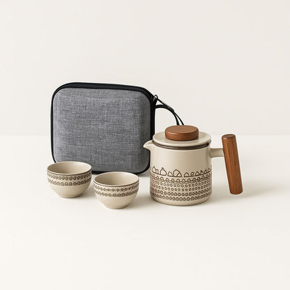 Portable ceramic teapot with matching cups designed for travel and outdoor tea ceremonies