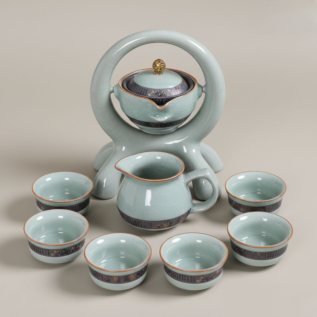 Ceramic rotating tea set with automatic pouring teapot and matching cups on wooden base