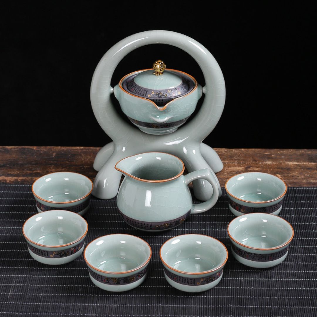 Complete ceramic tea set with rotating teapot and four matching teacups