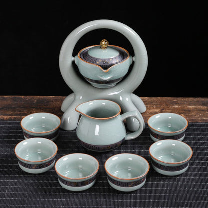 Complete ceramic tea set with rotating teapot and four matching teacups