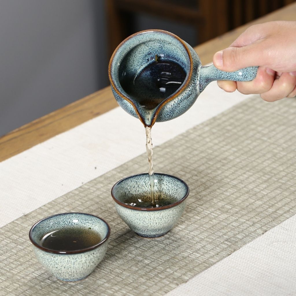 Complete ceramic tea service set with automatic pot fair cup and six teacups for home