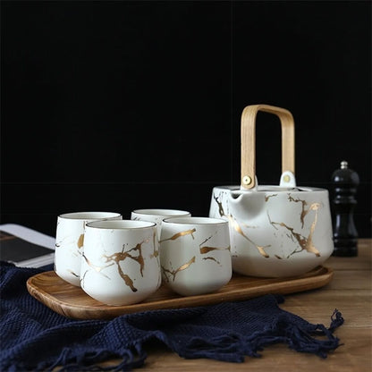 Close up of marble glaze ceramic finish on modern tea set with smooth texture