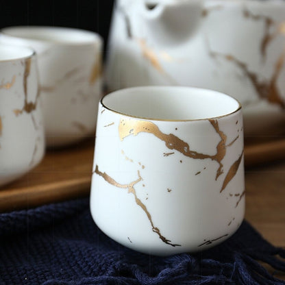 Four marble glaze ceramic teacups with smooth finish for tea serving

