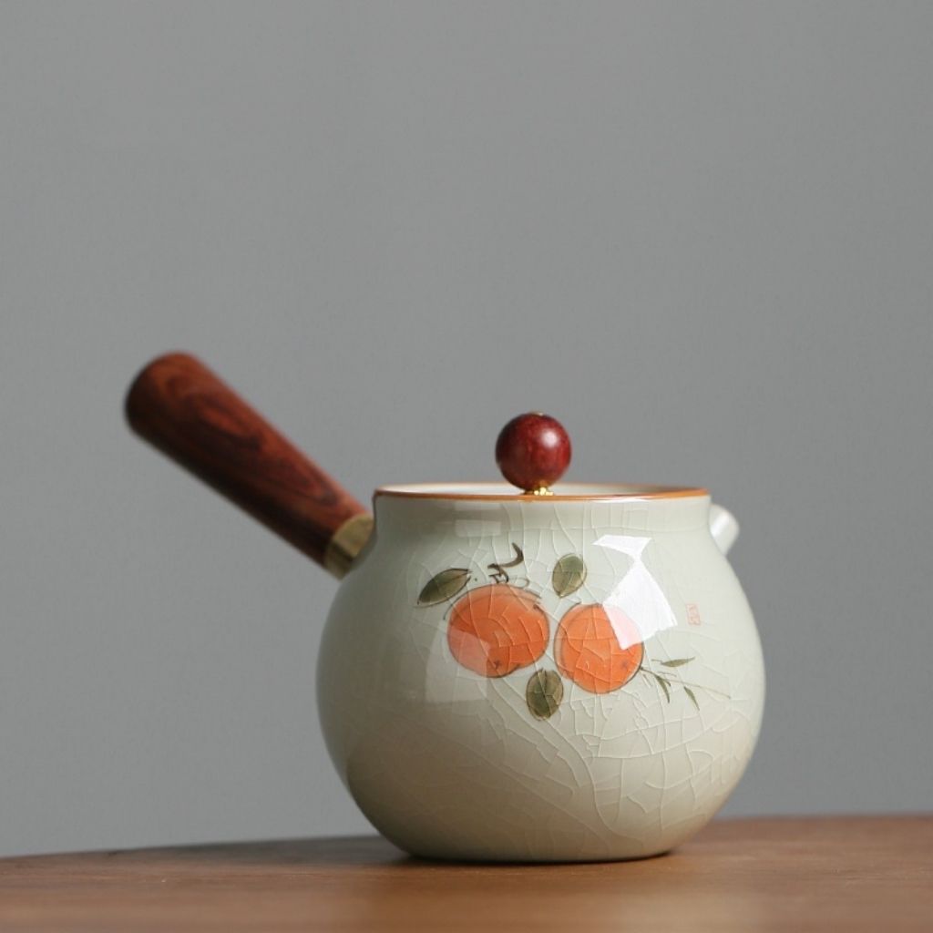 Wooden accented ceramic teapot with hand painted persimmon decoration