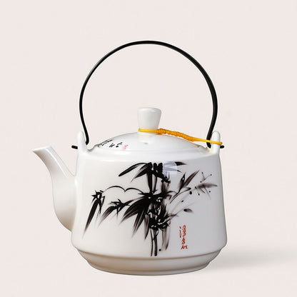 Ceramic teapot top view showing wide opening and fitted lid with knob