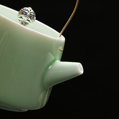 Small celadon ceramic teapot for single serve tea brewing