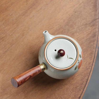 Artisan ceramic teapot with crackle glaze and side mounted handle