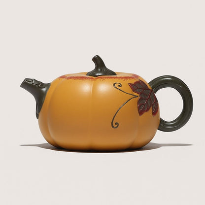Handcrafted clay teapot with enameled accents and smooth pouring spout
