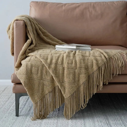 Soft acrylic jacquard throw blanket with comfortable knit texture and decorative fringe trim
