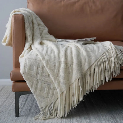 Versatile jacquard knit throw blanket suitable for beds sofas and chairs with fringe detail