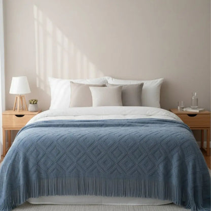  Detailed view of acrylic knit throw showing decorative fringe edges and jacquard weave texture