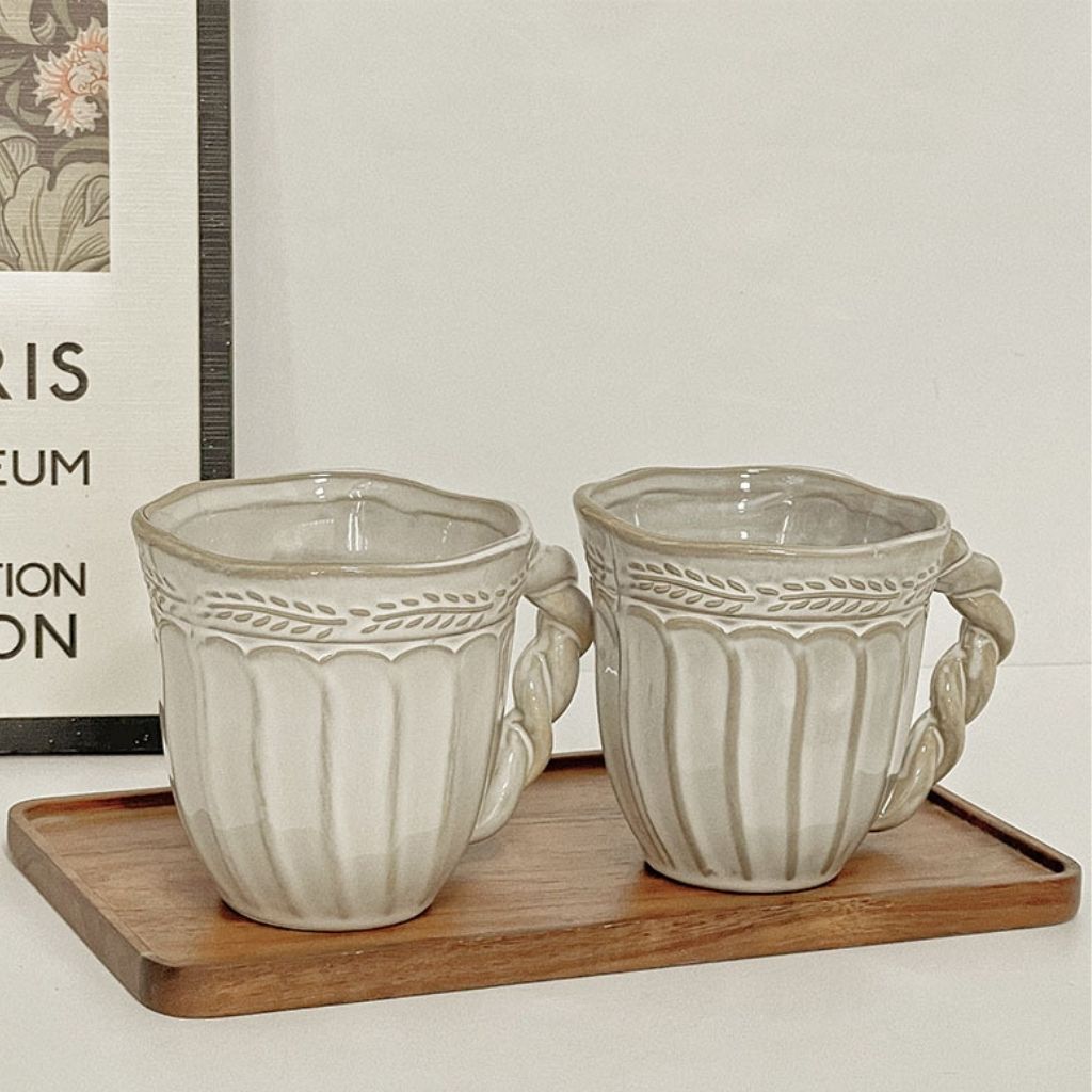 Ceramic coffee cup with vintage charm, handmade design perfect for serving hot beverages at home