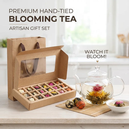 Premium hand-tied blooming tea artisan gift set with a teapot and tea balls on a wooden surface.