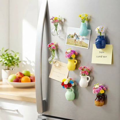 Decorative magnetic vases with flowers and notes on a refrigerator