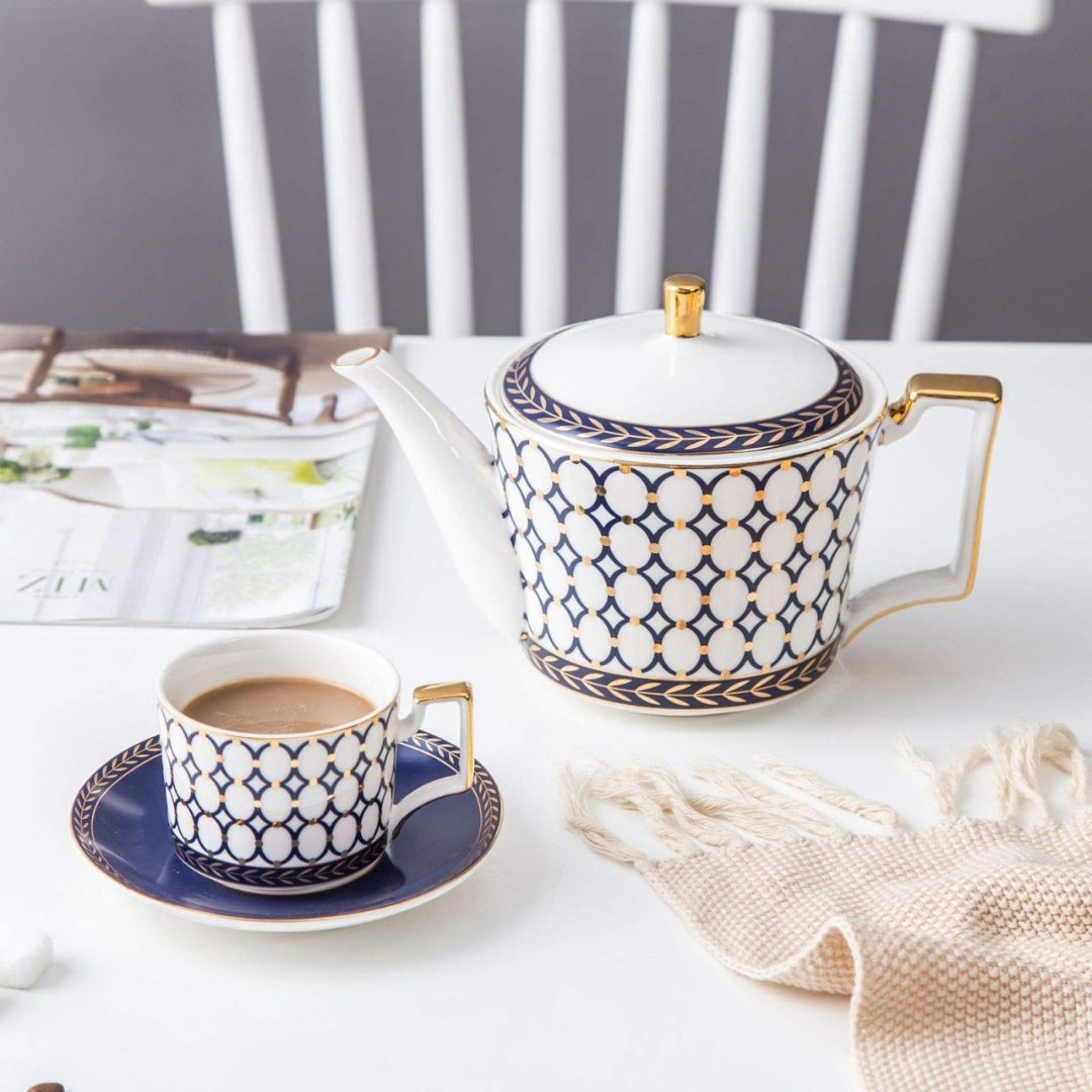 Bone china serving set with porcelain tea and coffee cups in white tableware
