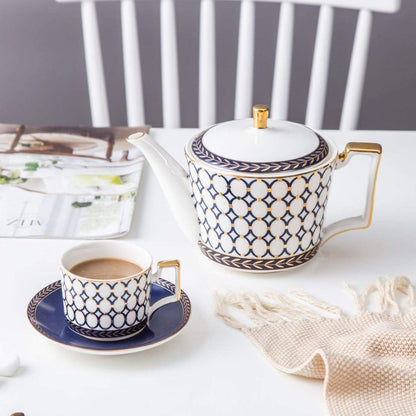 Bone china serving set with porcelain tea and coffee cups in white tableware