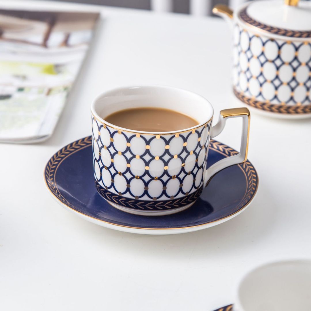 Porcelain tea and coffee set in bone china with white ceramic cups and saucers